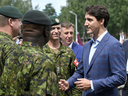 Prime Minister Justin Trudeau speaks to troops as he visits Adazi Military Base in Kadaga, Latvia, on July 10, 2018.