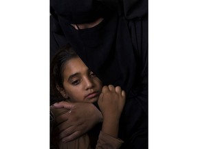 CORRECTS AGE FROM 12 TO 11 - Palestinian relatives of 11 year-old boy, Majdi al-Satari, who was shot and killed by Israeli troops on Friday's ongoing protest at the Gaza Strip's border with Israel, mourn at the family home during his funeral in town of Rafah, Southern Gaza Strip, Saturday, July 28, 2018. Gaza health officials said two Palestinians were killed and dozens injured by Israeli fire at a weekly border protest on Friday.