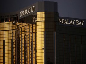 FILE - In this Oct. 3, 2017, file photo, windows are broken at the Mandalay Bay resort and casino in Las Vegas, the room from where Stephen Craig Paddock fired on a nearby music festival, killed 58 and injuring hundreds on Oct. 1, 2017. Attorneys in a negligence lawsuit stemming from the Las Vegas Strip shooting say the massacre could have been avoided if a hotel tightened security after a man was found with multiple weapons at the Mandalay Bay resort in 2014. Lawyer Robert Eglet said Friday, July 6, 2018, that the arrest of Kye Aaron Dunbar in a 24th-floor hotel room with guns including an assault-style rifle, tripod and a telescopic sight bears similarities to the Oct. 1 shooting.