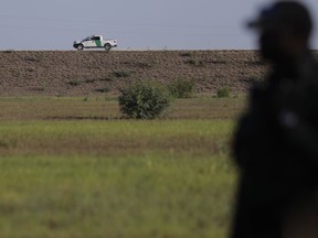 FILE - In this Aug. 11, 2017, file photo, U.S. Customs and Border Patrol agents patrol for immigrants suspected of crossing into the United States illegally along the Rio Grande near Granjeno, Texas. A U.S. official tells The Associated Press that Border Patrol arrests fell sharply in June 2018 to the lowest level since February, ending a streak of four straight monthly increases. The drop may reflect seasonal trends or it could signal that President Donald Trump's "zero-tolerance" policy to criminally prosecute every adult who enters the country illegally is having a deterrent effect. The official spoke on condition of anonymity because the numbers are not yet intended for public release.