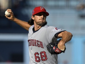 Pittsburgh Pirates starting pitcher Clay Holmes throws during the first inning of the team's baseball game against the Los Angeles Dodgers on Wednesday, July 4, 2018, in Los Angeles.