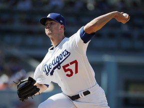 Los Angeles Dodgers starting pitcher Alex Wood throws to a Los Angeles Angels batter during the first inning of a baseball game Saturday, July 14, 2018, in Los Angeles.