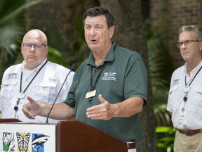 Ron Forman, center, President and CEO of the Audubon Nature Institute, speaks during a press conference at the Audubon Zoo, Saturday, July 14, 2018 in New Orleans. The Audubon Zoo closed Saturday after a jaguar escaped from its habitat and killed six animals, according to a release from zoo officials.