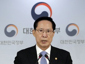 South Korea's Defense Minister Song Young-moo speaks to the media during a briefing at the government complex in Seoul, South Korea, Tuesday, July 10, 2018. South Korea has suspended its summertime civil defense drills aimed at preparing against a North Korean attack to keep alive a positive atmosphere for nuclear diplomacy with the North.
