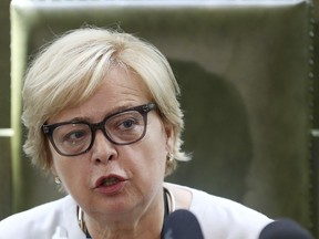 FILE - In this Wednesday, July 4, 2018 file photo, Malgorzata Gersdorf, first president of the Polish Supreme Court, speaks to reporters in Warsaw, Poland. The ruling right-wing Law and Justice party considers Judge Malgorzata Gersdorf to be retired in light of recent legislation that lowered age limits for judges. Gersdorf, however, has continued to show up for work, insisting that, according to the constitution, her term runs until early 2020.