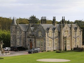 FILE - This Friday Oct. 6, 2017 file photo shows a view of MacLeod House, a sixteen room boutique hotel, at the Trump International golf course in Balmedie, Scotland. Documents show that U.S. President Donald Trump's family business has "destroyed the vast majority'' of an environmentally sensitive patch of sand dunes near its golf course north of Aberdeen in Scotland. Scottish Natural Heritage, which is responsible for the management and monitoring of sites of special scientific interest, has found that construction of the golf course has "led to direct loss of" as much as 68 hectares (168 acres) of mobile sand dunes protected under Scottish law.