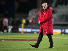 FILE - In this Saturday, July 8, 2017 file photo, British and Irish Lions head coach Warren Gatland walks on the field in Auckland, New Zealand. The Welsh Rugby Union says on Monday, July 9, 2018 former New Zealand police constable Wayne Pivac will take over from Warren Gatland as coach of the national team after next year's World Cup. Pivac has performed the same role at the Scarlets since 2014.