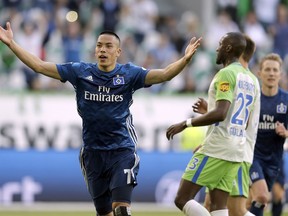 FILE - In this Saturday, April 28, 2018 file photo, Hamburg's Bobby Wood celebrates after scoring during their German Bundesliga soccer match against VfL Wolfsburg in Wolfsburg, Germany. United States striker Bobby Wood has moved to Bundesliga side Hannover from relegated Hamburger SV. Hannover says on Monday, July 9 the 25-year-old Wood is joining on loan for one year, with the option to then make the switch permanent.