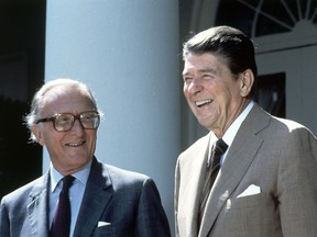 FILE- In this file photo dated Tuesday, Sept. 11, 1984, US President Ronald Reagan and NATO Secretary General Lord Carrington, left, pose for photographers in the Rose Garden prior to talks at the White House in Washington, D.C., United States.  Peter Carrington, a long-serving British politician who was the last survivor of Prime Minister Winston Churchill's government, died aged 99 on Monday July 9, 2018, according to the House of Lords website.