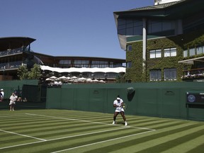 Serena Williams practices on the grass court at Wimbledon, ahead of the start of the 2018 Wimbledon Tennis Championships, in London Saturday June 30, 2018.  Williams is scheduled to play Dutch contender Arantxa Rus at Wimbledon on July 2.