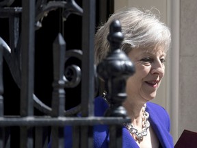 Britain's Prime Minister Theresa May leaves 10 Downing Street in London, bound for the House of Commons to face Prime Minister's Questions, Wednesday July 4, 2018.