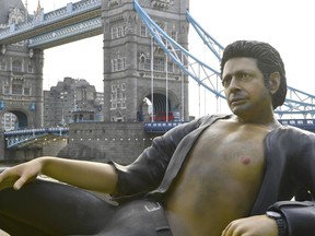 A 25ft statue of actor Jeff Goldblum's in a pose from a scene in the first Jurassic Park movie, which has been created by a TV channel to celebrate the film's 25th birthday, at Potters Fields Park, London, Wednesday July 18, 2018.