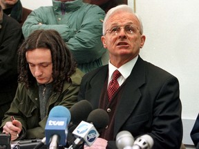 FILE - In this Tuesday Feb. 2, 1999 file photo, Adem Demaci, right, the political representative of the Kosovo Liberation Army, talks to the media during a press conference in Pristina. Adem Demaci, a human rights defender who embodied Kosovo's national resistance and was often called the "Balkans' Mandela," has died at 82, it was reported on Thursday July 26, 2018.