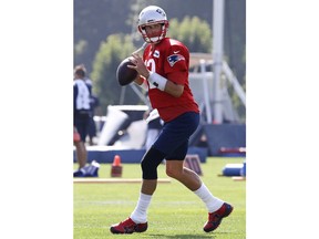 New England Patriots quarterback Tom Brady fades back to pass during the team's NFL football training camp in Foxborough, Mass., Friday, July 27, 2018.