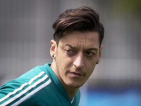 FILE-In this June 14 file photo Mesut Oezil looks around during a training session of the German team at the 2018 soccer World Cup in Vatutinki near Moscow, Russia, Thursday, June 14, 2018.
