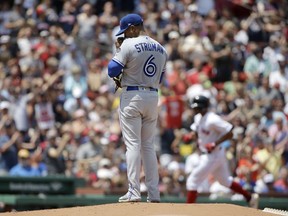 Toronto Blue Jays' Marcus Stroman (6) stands on the mound as Boston Red Sox's Xander Bogaerts, right, runs the bases after hitting a home run in the first inning of a baseball game, Sunday, July 15, 2018, in Boston.