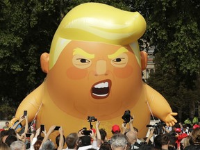 Trump has been long unpopular in Britain. A six-meter high cartoon baby blimp mocking the U.S. president is flown as a protest against his visit, in Parliament Square in London, England, Friday, July 13, 2018.