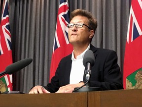 The Manitoba government says it won't proceed with plans to further privatize the province's air services unless private-sector bidders prove they can provide the same level of service and safety and better value. Manitoba Infrastructure Minister Ron Schuler speaks to media in Winnipeg on Thursday, July 26, 2018.