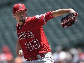 Los Angeles Angels pitcher Deck McGuire throws to the Baltimore Orioles in the first inning of a baseball game, Sunday, July 1, 2018, in Baltimore.