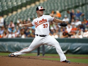 Baltimore Orioles starting pitcher Dylan Bundy throws to a New York Yankees batter during the first inning of a baseball game Wednesday, July 11, 2018, in Baltimore.