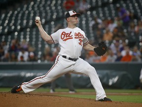 Baltimore Orioles starting pitcher Dylan Bundy throws to the Boston Red Sox during the first inning of a baseball game Wednesday, July 25, 2018, in Baltimore.