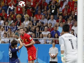 Belgium's Jan Vertonghen, second left, heads the ball to score his side's first goal during the round of 16 match between Belgium and Japan at the 2018 soccer World Cup in the Rostov Arena, in Rostov-on-Don, Russia, Monday, July 2, 2018.