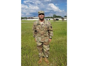 This July 12, 2018 photo provided by Jaime Lugo shows Haeder Al Anbki at Camp Blanding in Jacksonville, Fla. Al Anbki, a former interpreter for U.S. forces in Iraq, is suing the U.S. government for blocking his path to citizenship over what he says are unfounded reasons that have primarily been applied to people from majority-Muslim countries. Al Anbki says he was scheduled to take the citizenship oath in June 2017 when he was told at the ceremony he couldn't be naturalized.