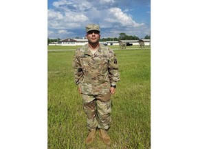 FILE- This July 12, 2018 file photo made available by Jaime Lugo shows Haeder Al Anbki at Camp Blanding in Jacksonville, Fla. More than a year after a former interpreter for U.S. military forces in Iraq was pulled out of a U.S. citizenship ceremony without explanation, he's about to be naturalized. Haeder Al Anbki said Monday, July 23, 2018, that he was notified over the weekend that he could participate in a naturalization ceremony next week in Orlando.