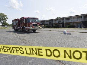 Crews investigate a fire Saturday, July 28, 2018, at the Cosmo Extended Living Motel, in Sodus Township, Mich., that claimed the lives of a 26-year-old mother and her five children.