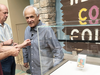 Marshall Fogell stands next to the display case containing one of the rarest baseball cards circulating, a 1952 Topps Mickey Mantle, that he owns.