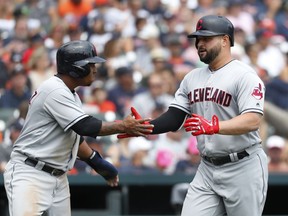 Cleveland Indians' Yonder Alonso, right, is congratulated by Jose Ramirez after hitting a two-run home run in the third inning of a baseball game against the Detroit Tigers in Detroit, Sunday, July 29, 2018.