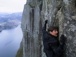 King Tom Cruise as Ethan Hunt, somehow not killing himself on the side of a mountain.