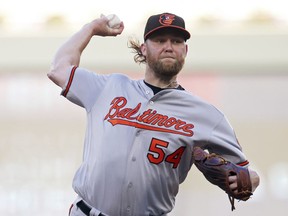 Baltimore Orioles pitcher Andrew Cashner throws to a Minnesota Twins batter during the first inning of a baseball game Thursday, July 5, 2018, in Minneapolis.