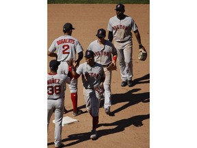 Players for the Boston Red Sox celebrate after a baseball game against the Kansas City Royals, Sunday, July 8, 2018, in Kansas City, Mo.