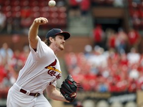 St. Louis Cardinals starting pitcher Miles Mikolas throws during the first inning of a baseball game against the Cincinnati Reds, Sunday, July 15, 2018, in St. Louis.