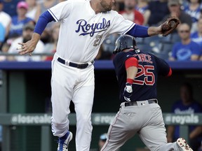 Boston Red Sox's Steve Pearce (25) beats out an infield hit past Kansas City Royals first baseman Lucas Duda (21) during the first inning of a baseball game at Kauffman Stadium in Kansas City, Mo., Friday, July 6, 2018.