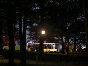 Emergency responders work at Table Rock Lake after a deadly boat accident in Branson, Mo., Thursday, July 19, 2018. A sheriff in Missouri said a tourist boat has apparently capsized on the lake, leaving several people dead and several others hospitalized.