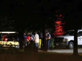 Rescue crews work at the scene of a deadly boat accident at Table Rock Lake in Branson, Mo., Thursday, July 19, 2018. A sheriff in Missouri said a tourist boat has apparently capsized on the lake, leaving several people dead and several others hospitalized.