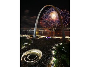 Fireworks explode over the Mississippi River in front of the Arch in downtown St. Louis on Wednesday, July 4, 2018. Pictured to the bottom left is the newly opened museum entrance to the Arch.
