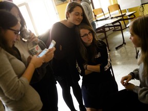 In this Monday, June 25, 2018, photo, Laura Schulmann, right, and Sophie Steiert, left, answer questions from students about Jewish daily life in Germany after a lesson, as part of a project about religions at the Bohnstedt Gymnasium high school in Luckau, German.