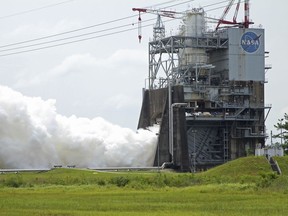 An AR-22 rocket engine is test fired on the A-2 test stand at the NASA Stennis Space Center in Stennis, Miss., Monday, July 2, 2018. Triggering a massive cloud of vapor and a roar, officials on Monday test fired the rocket engine designed to be part of a reusable spacecraft that can launch into space repeatedly with a quick turnaround time.