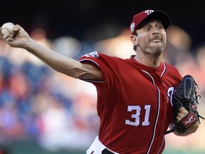 Washington Nationals starting pitcher Max Scherzer (31) delivers against the Miami Marlins during the first inning of their baseball game at Nationals Park in Washington, Saturday, July 7, 2018.