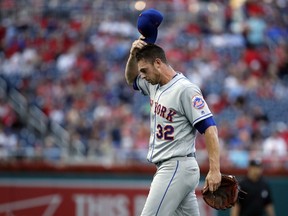 New York Mets starting pitcher Steven Matz scratches his head as he walks to the dugout after being relieved during the first inning of the team's baseball game against the Washington Nationals at Nationals Park, Tuesday, July 31, 2018, in Washington.