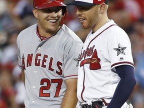 Los Angeles Angels of Anaheim outfielder Mike Trout (27) talks with Atlanta Braves first baseman Freddie Freeman (5) during the Major League Baseball All-star Game, Tuesday, July 17, 2018 in Washington.