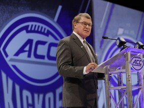 Atlantic Coast Conference commissioner John Swofford speaks during a news conference at the ACC NCAA college football media day in Charlotte, N.C., Wednesday, July 18, 2018.