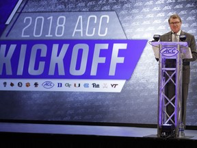 Atlantic Coast Conference commissioner John Swofford speaks during a news conference at the ACC NCAA college football media day in Charlotte, N.C., Wednesday, July 18, 2018.