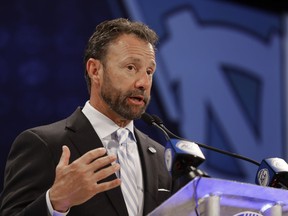 North Carolina head coach Larry Fedora answers a question during a news conference at the NCAA Atlantic Coast Conference college football media day in Charlotte, N.C., Wednesday, July 18, 2018.