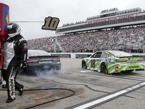 Kyle Busch (18) overtakes Aric Almirola (10) on a pit stop during a NASCAR Cup Series auto race Sunday, July 22, 2018, at New Hampshire Motor Speedway in Loudon, N.H.