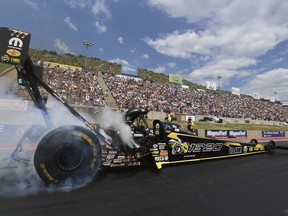 In this photo provided by the NHRA, Leah Pritchett powers to the Top Fuel victory at the annual Dodge Mile-High NHRA Nationals at Bandimere Speedway in Denver, Sunday, July 22, 2018.