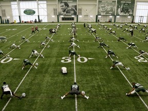 New York Jets players stretch during NFL football training camp, Friday, July 27, 2018, in Florham Park, N.J.